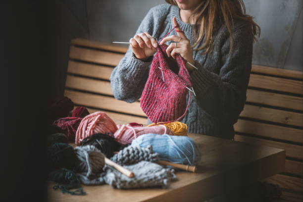 istock Close up on woman's hands knitting 1131260112