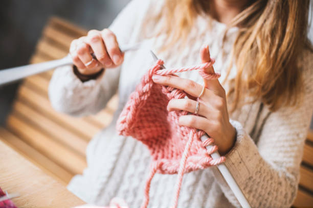 istock Close up on woman's hands knitting 1131260116