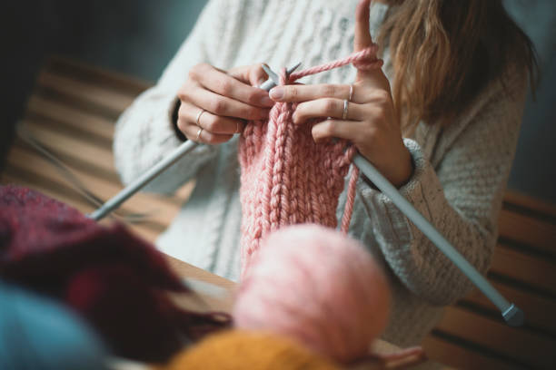 istock Close up on woman's hands knitting 1131260123
