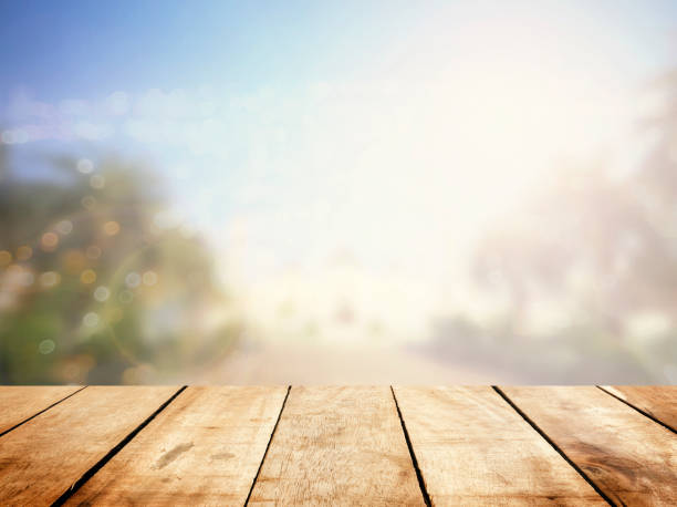 Perspective wood floor on blur mosque ramadan background. Window breakfast table top view bokeh in eid mubarak concept for montage presentation in fasting festival, culture of muslim religious.
