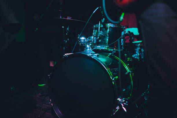 istock Modern drum set shot in smoky dark studio. 1131260393