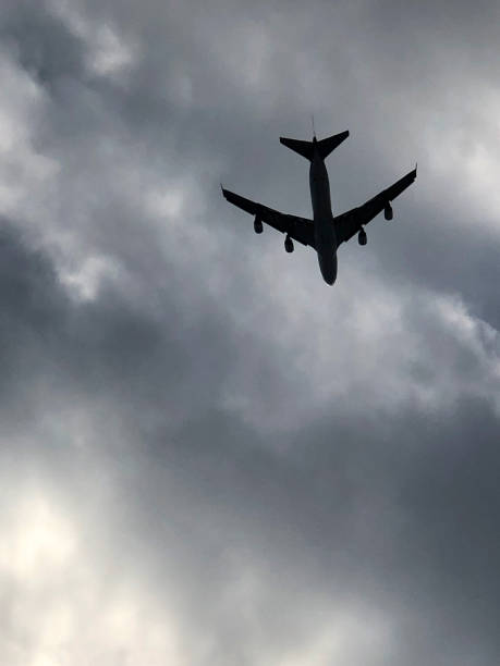 istock The silhouette of a passenger plane flying 1131262144