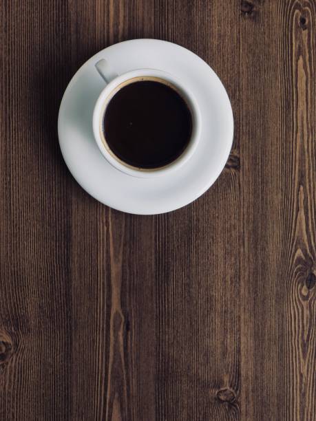 Wooden board background with coffee Shot in studio 컵 stock pictures, royalty-free photos & images