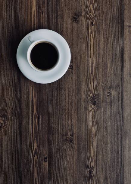 Wooden board background with coffee Shot in studio 컵 stock pictures, royalty-free photos & images