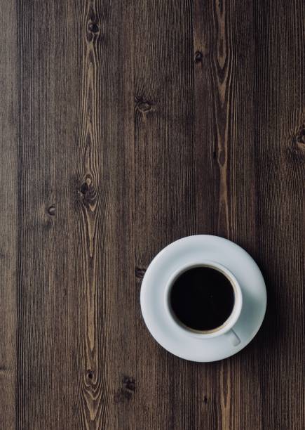 Wooden board background with coffee Shot in studio 컵 stock pictures, royalty-free photos & images