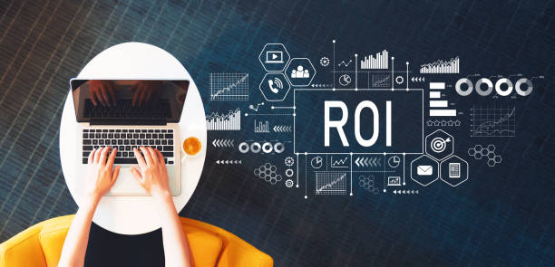 ROI with person using a laptop ROI with person using a laptop on a white table return on investment photos stock pictures, royalty-free photos & images