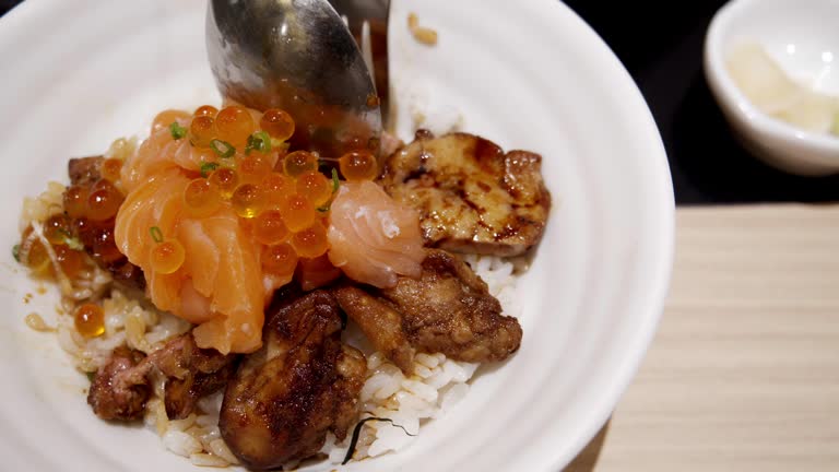 Foie gras urchin Ikura don.served over rice.