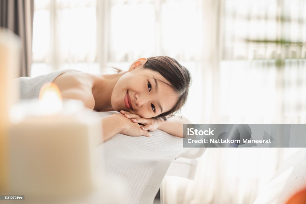 Young Asian beauty woman enjoying massage and spa Adult Stock Photo