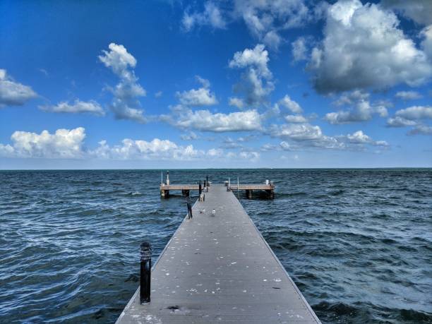 istock Dock in Grand Cayman islands with dramatic clouds 1131272511