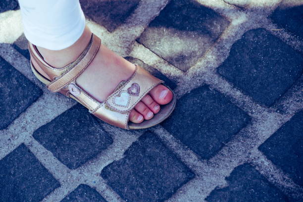 istock Small girls with sandals 1131272848