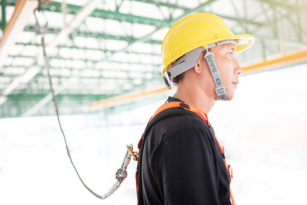 istock Industrial Worker with safety protective equipment loop hanging on the bar 1131273608