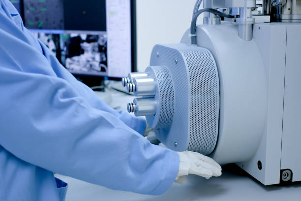 istock Scientist are opening the nanomaterials for Scanning Electron Microscope (SEM) machine in laboratory 1131273818