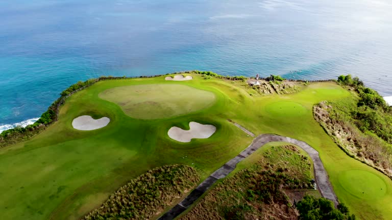 Aerial view luxury golf field next the cliff. Bali, Indonesia