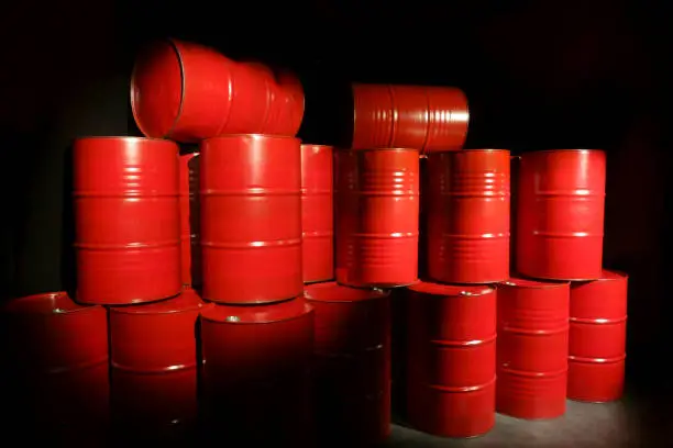 Photo of Red chemical barrels in a stack