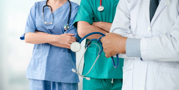istock Doctor working in hospital with other doctors. 1131277363