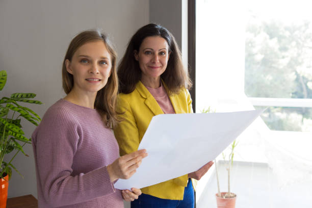 istock Architect showing house design drawing to customer 1131277428