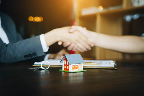 istock Real estate agents agree and customer shaking hands after signing contract documents for realty purchase.Concept mortgage loan approvalม home loan and insurance concept 1131278223