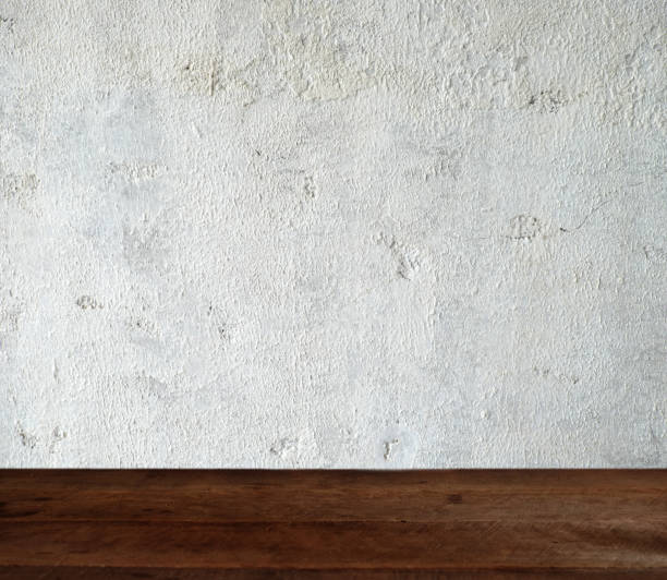 istock Empty wood table top on White old cement wall concrete backgrounds textured. can be used for display or montage your products 1131278281