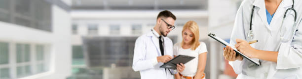 istock Doctor working in hospital with other doctors. 1131278645