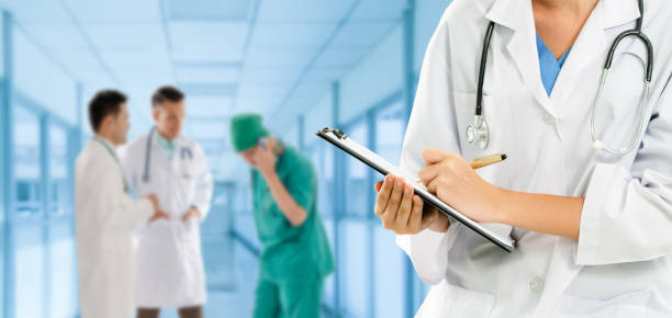 istock Doctor working in hospital with other doctors. 1131280013