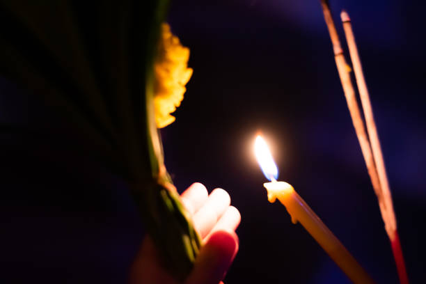 istock burned incense stick and candles at night on the holy day. 1131287021