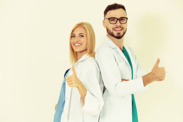 istock Portrait of confident doctors on white background. 1131287041