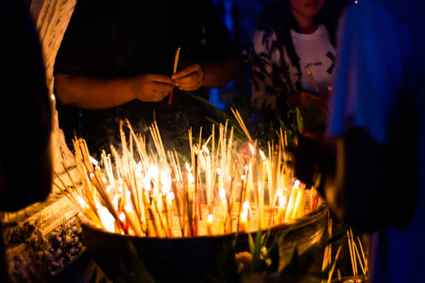istock incense stick and candles burned on the holy day. 1131287053