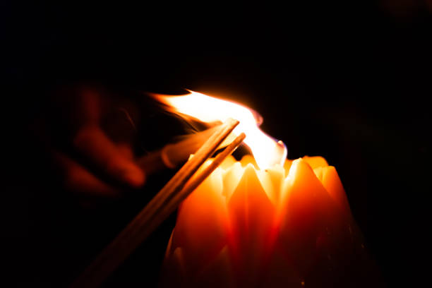 istock burned incense stick and candles at night on the holy day. 1131288197
