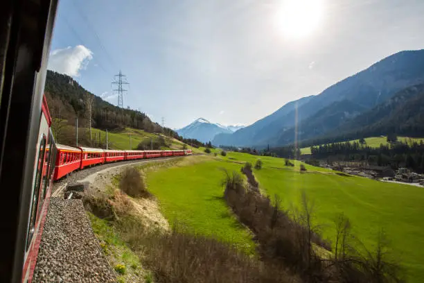 Bernina Express is passing the meadow - Switzerland