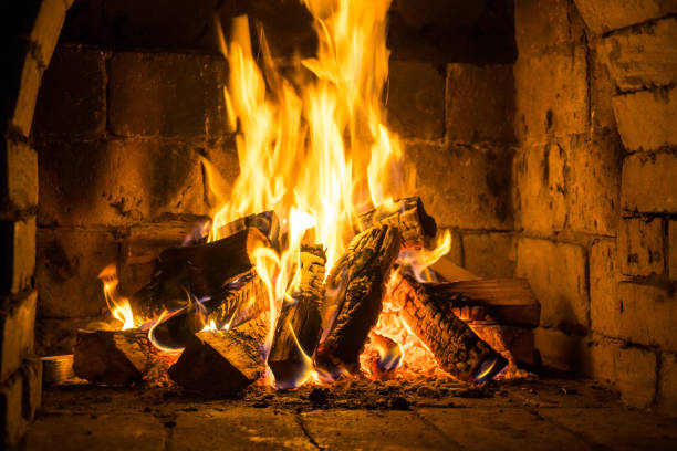 istock Wood burning in a cozy fireplace at home, keep warm 1131290578