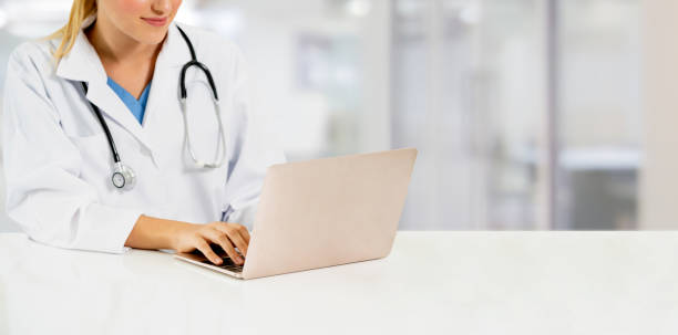 istock Doctor using laptop computer at the hospital. 1131290733