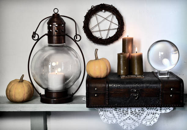 istock Pentagram, magic crystal ball, old lamp and pumpkins on shelf. 1131293690