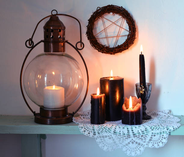 istock Burning black candles, old-fashioned lamp and pentagram 1131294331