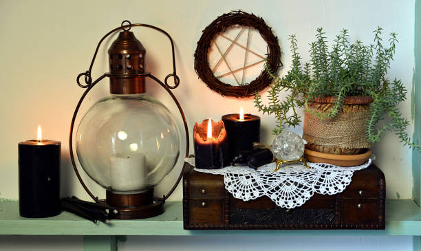 istock Old-fashioned lamp, black candles, succulent plant and pentagram 1131294668
