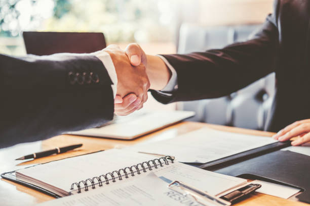 istock Shaking hands Business people greeting new colleagues while job interviewing shaking hands meeting Planning after during job interview Concept 1131299203