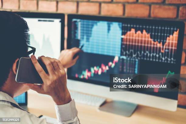 Investment Stock Market Entrepreneur Business Man Discussing And Analysis Graph Stock Market Tradingstock Chart Concept Stock Photo - Download Image Now
