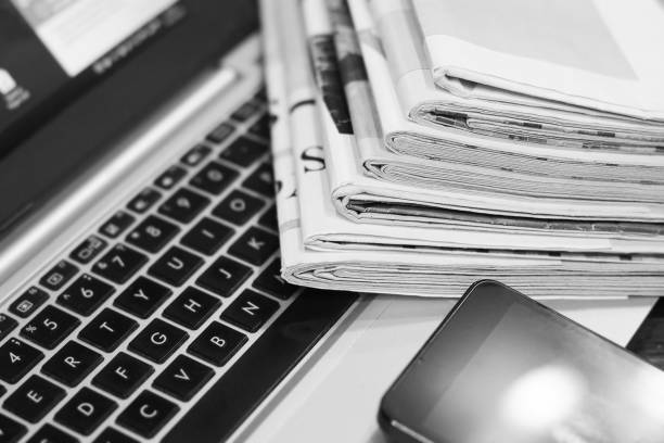 istock Newspapers, Laptop and Smart Phone 1131299372