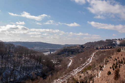 Pittsburgh, Pennsylvania, USA 02/21/2019 Frick Park, looking into Duck Hollow from the Summerset neighborhood with the Homestead Grays bridge in the distance on a sunny winter day