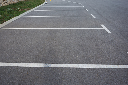 parking lots and buses at the road marked with white lines