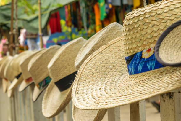 istock Summer beach hats on display at craft market 1131305069