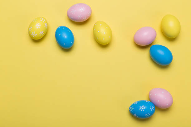 istock easter eggs on yellow pastel color background with space. Concept 1131305151