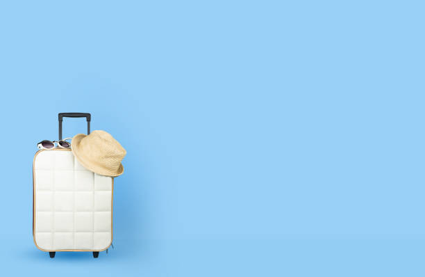 istock Travel bag with accessories on color background 1131307415