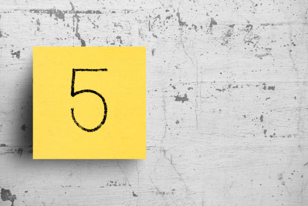 Sticky note on concrete wall, Number 5 Sticky note on concrete wall, Number 5 number 5 photos stock pictures, royalty-free photos & images