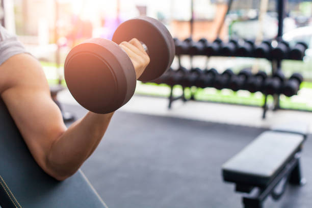 istock close up Hand holding weight in gym 1131312621