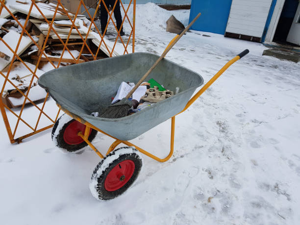 istock wheelbarrow or cart on wheels with garbage in winter 1131315051