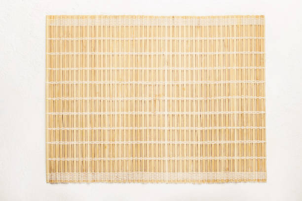 istock Empty Asian Food Background. Bamboo mat on white background 1131315812