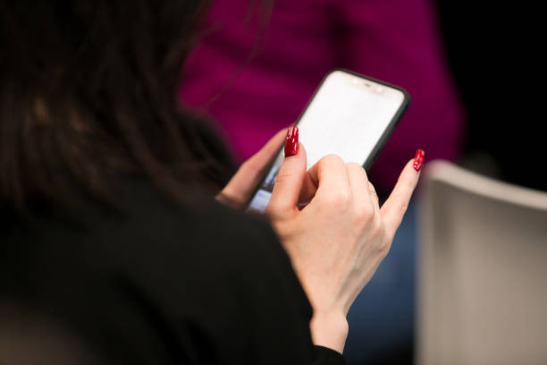 istock writes to the phone at the conference 1131315991