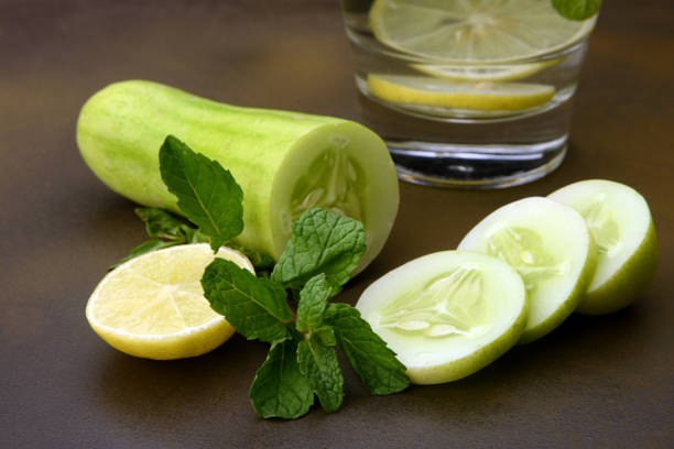 istock A glass of water with Cucumber, Lemon and Mint leaf 1131316295