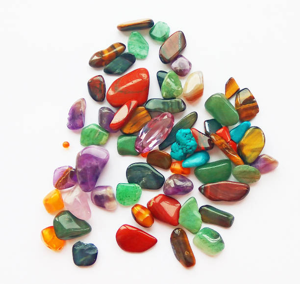 istock Assorted natural bright coloured semi precious gemstones and gems on white background 1131316963