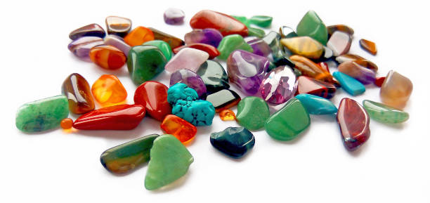 istock Assorted natural bright coloured semi precious gemstones and gems on white background 1131316977